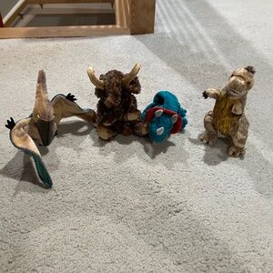 Lot of 4 prehistoric-themed TY Beanie Babies.